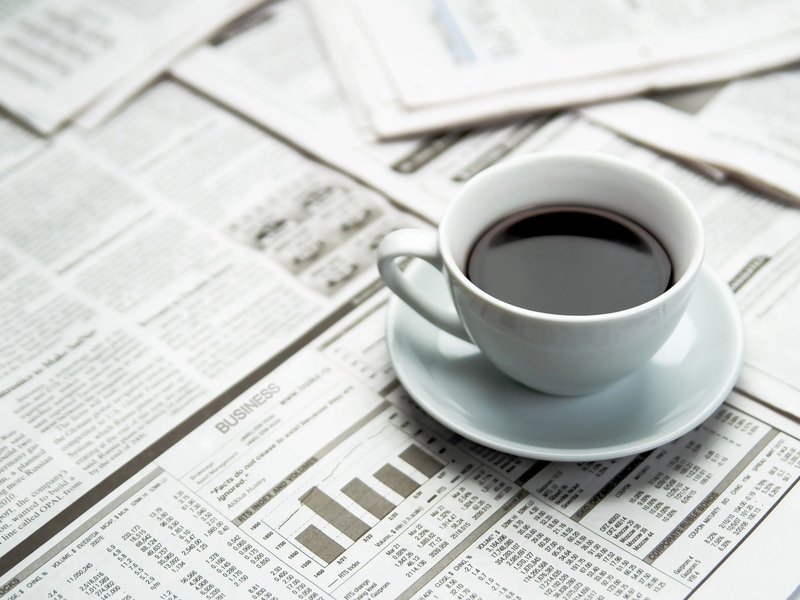 coffee on a newspaper - bdflooringinc